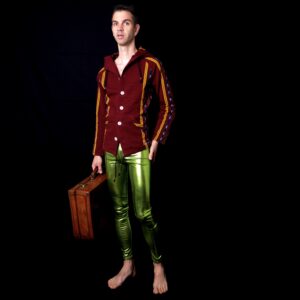 Guy in shiny leggings with suitcase